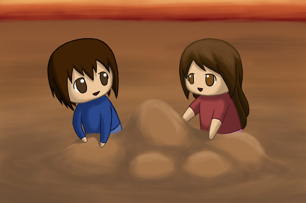 Boy and girl builds a sand castle on the beach.