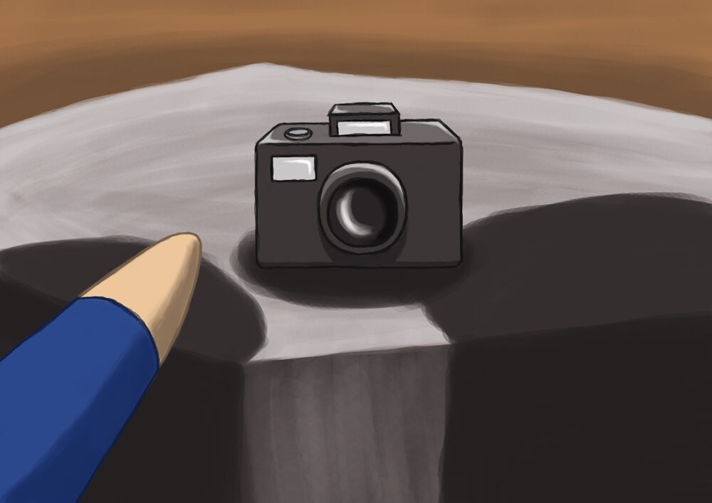 Boy puts a camera on a rock prepared to take a photo.