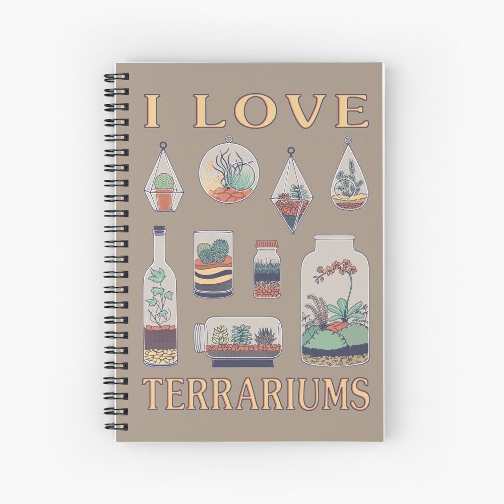 Photo mock-up of 'I Love Terrariums' printed on the cover of a notebook.