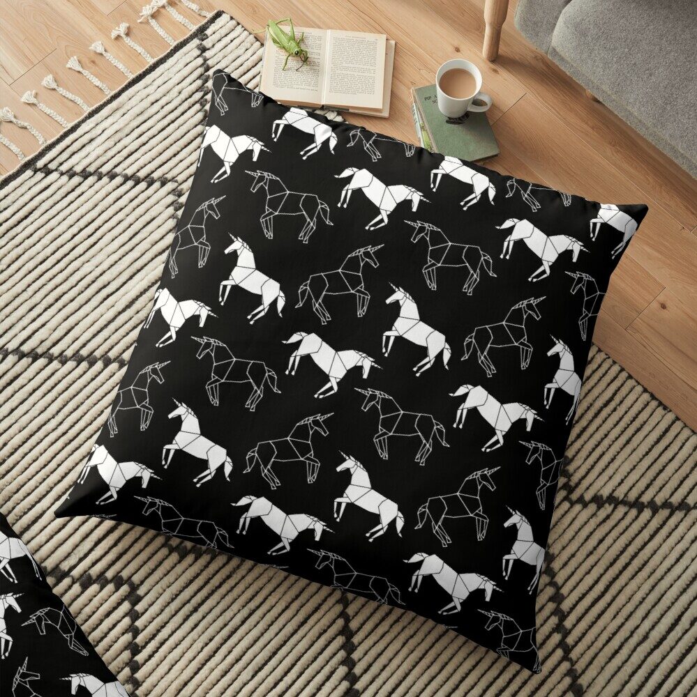 Photo mock-up of 'Origami Unicorn Pattern' printed on a square pillow case.